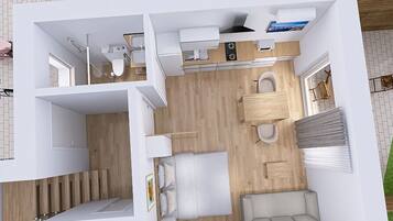 Ein modernes Interieur mit Küche, Essbereich und Treppe.