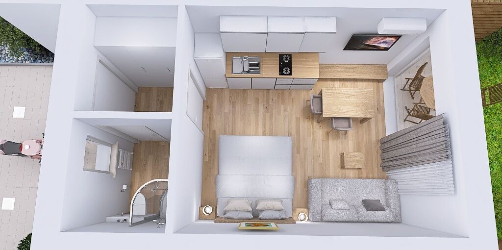 Un intérieur moderne comprenant un lit, une table de chevet et une petite kitchenette.