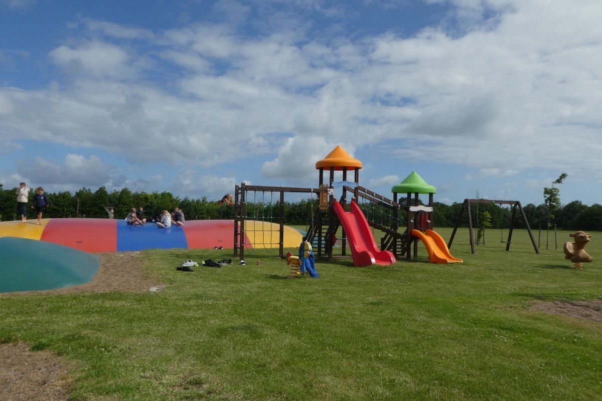 A playground with slides and climbing structures.