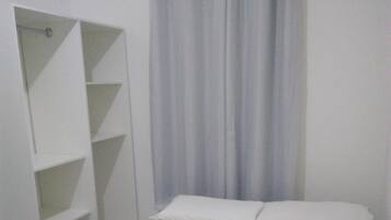 Frigobar, cortinas blackout, Wi-Fi de cortesia, roupa de cama