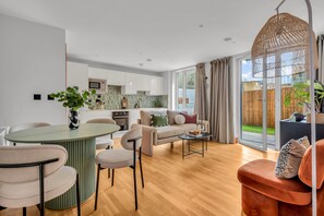 Classic Apartment, 2 Bedrooms, City View | Living area | 32-inch flat-screen TV with cable channels, TV