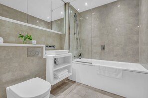Classic Apartment, 2 Bedrooms, City View | Bathroom | Combined shower/tub, free toiletries, hair dryer, towels