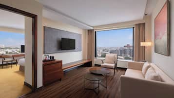 Executive Suite, 1 King Bed | Living room | 40-inch LED TV with cable channels, TV, pay films