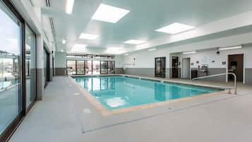 Indoor pool, open 8:00 AM to 10:00 PM, pool loungers
