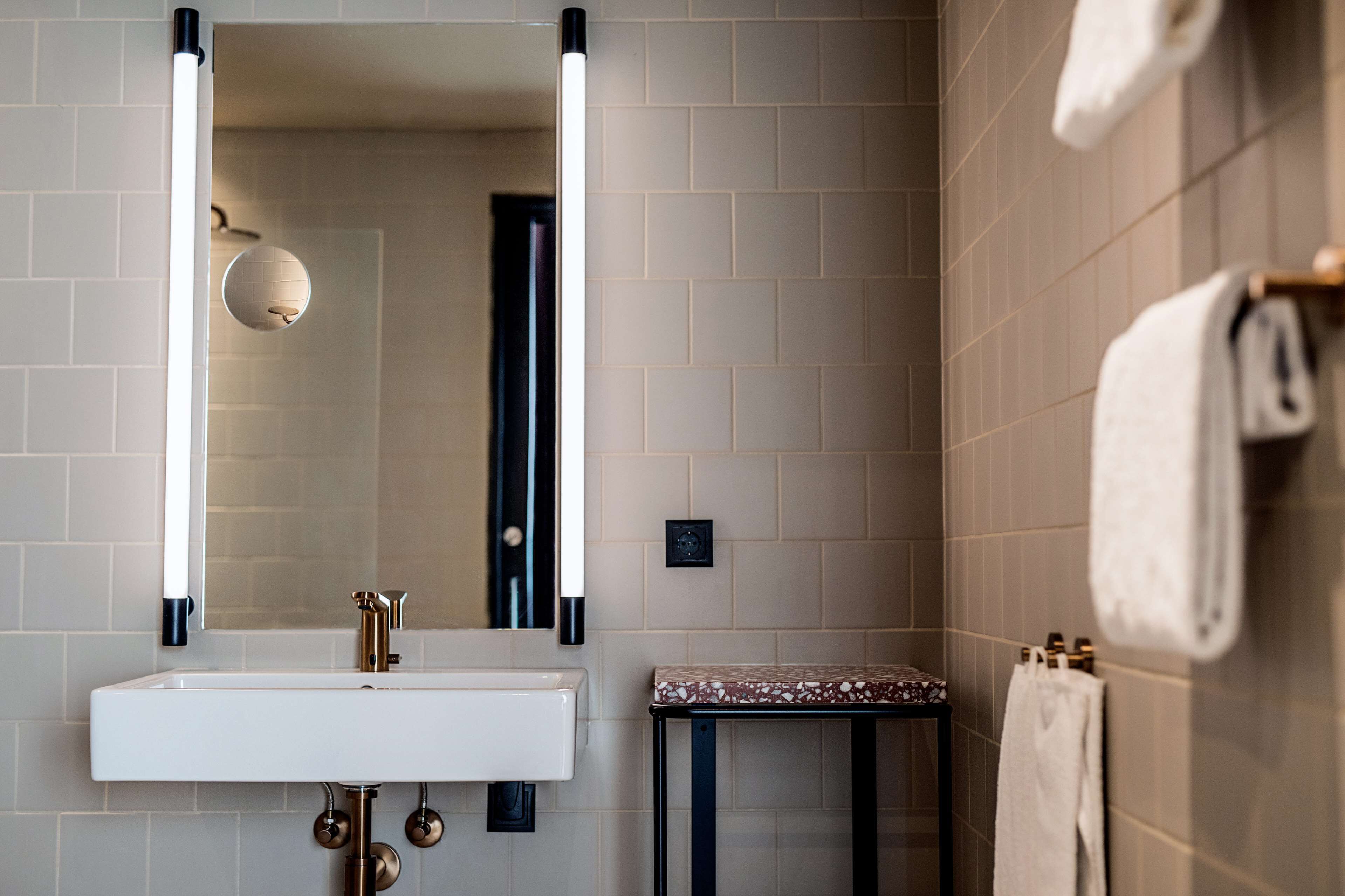 shower, designer toiletries, hair dryer, towels