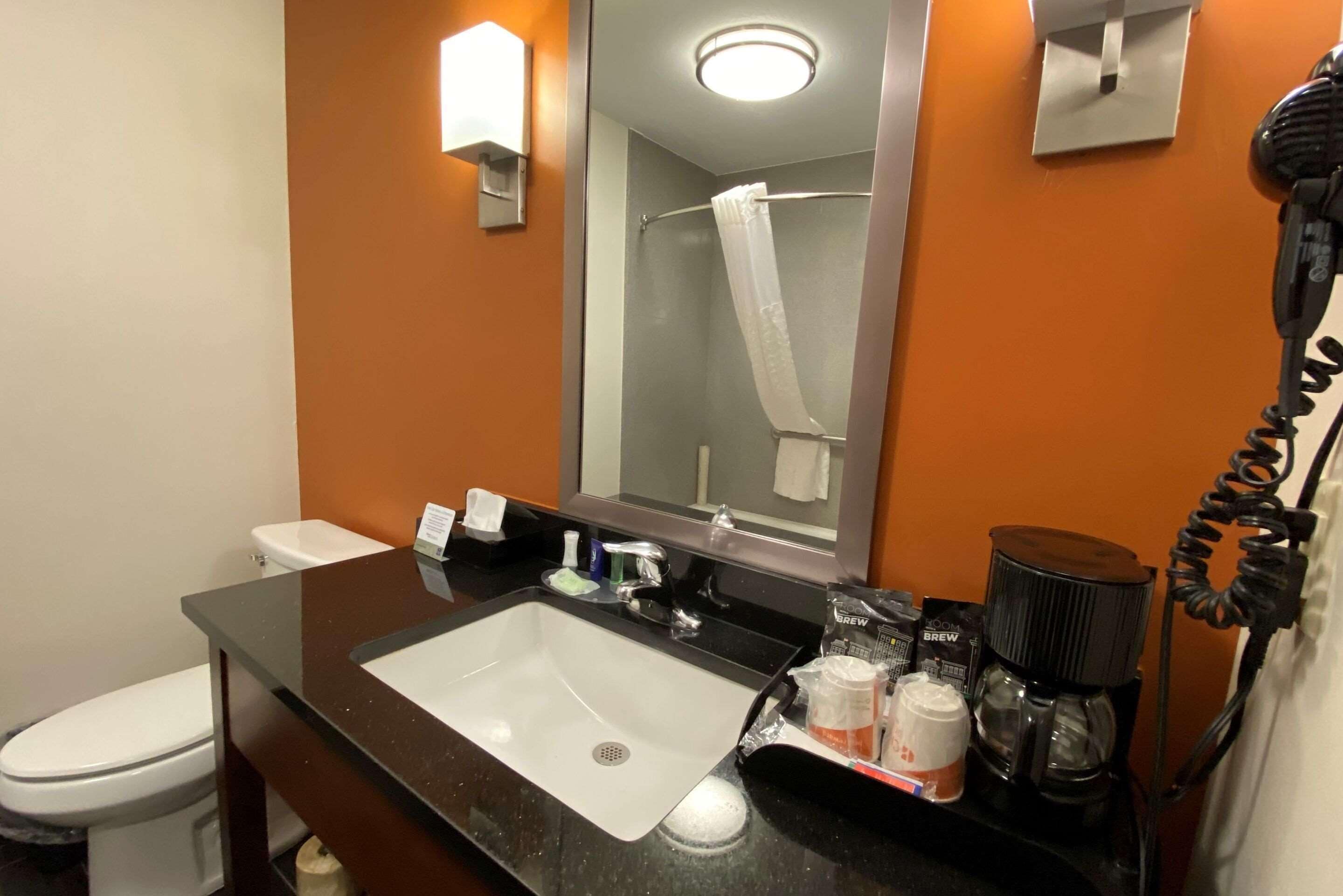 bathtub, hair dryer, towels