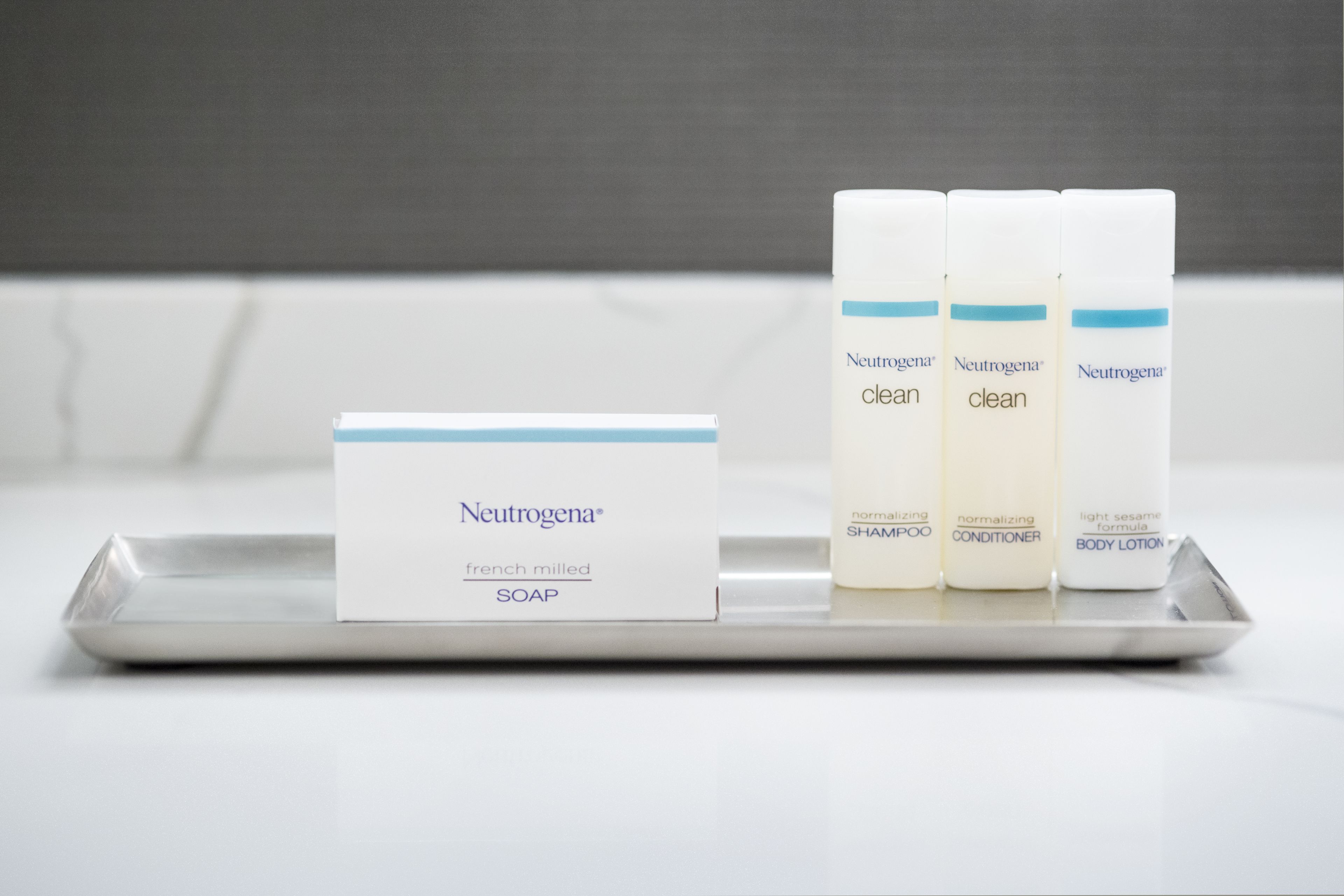 A tray with three Neutrogena products and a card.