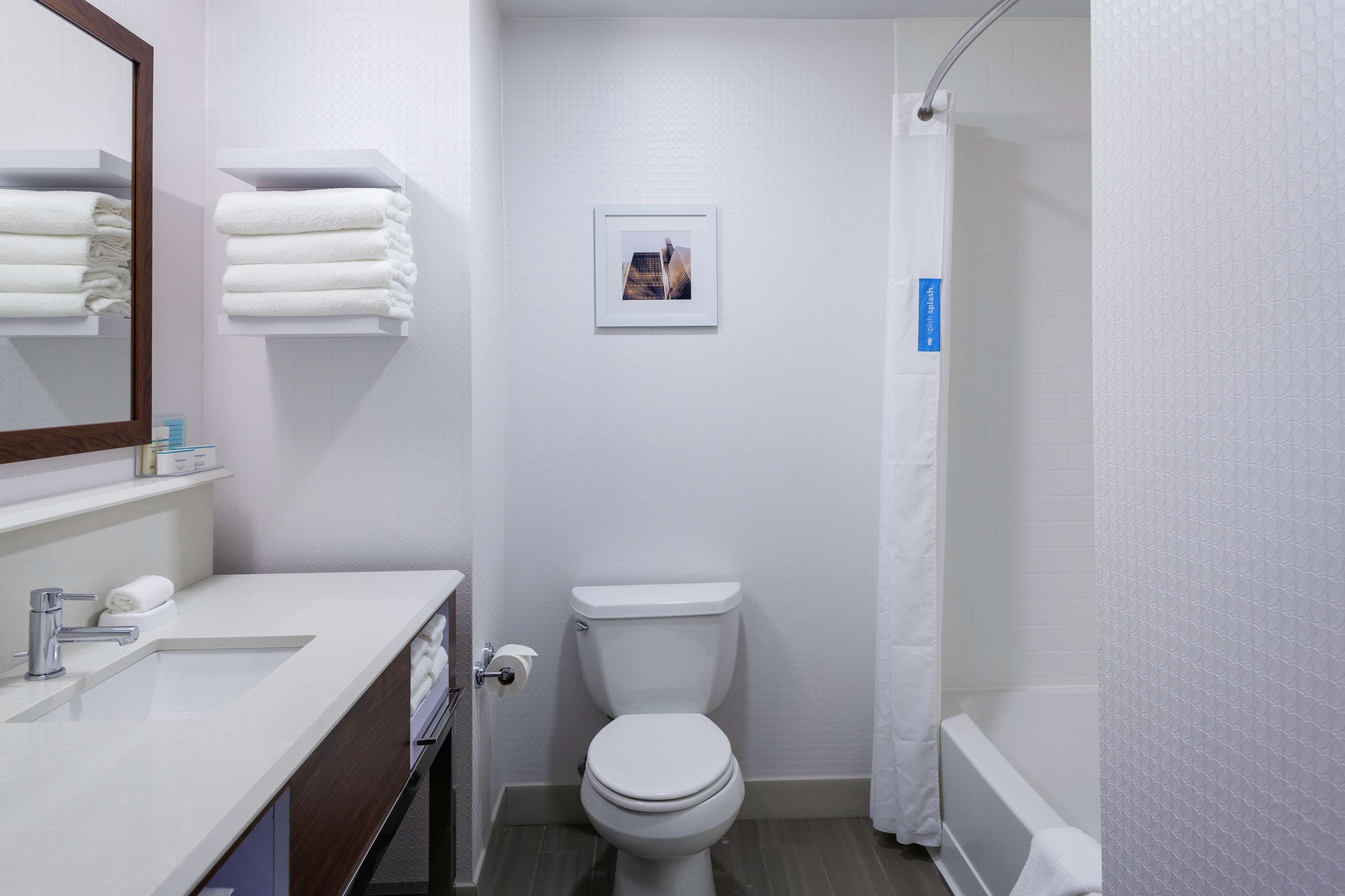 designer toiletries, hair dryer, towels