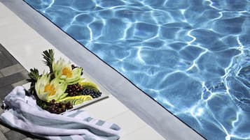 Outdoor pool, open 8:00 AM to 7:00 PM, free pool cabanas, pool umbrellas