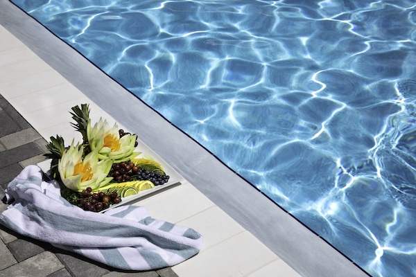 Outdoor pool, open 8:00 AM to 7:00 PM, free cabanas, pool umbrellas