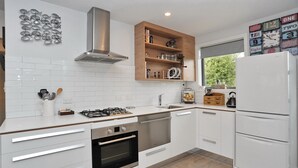 Charles St Apartment | Private kitchen | Fridge, microwave, oven, stovetop - Charles St Apartment (Christchurch)