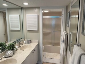 Combined shower/bathtub, hair dryer, towels, soap