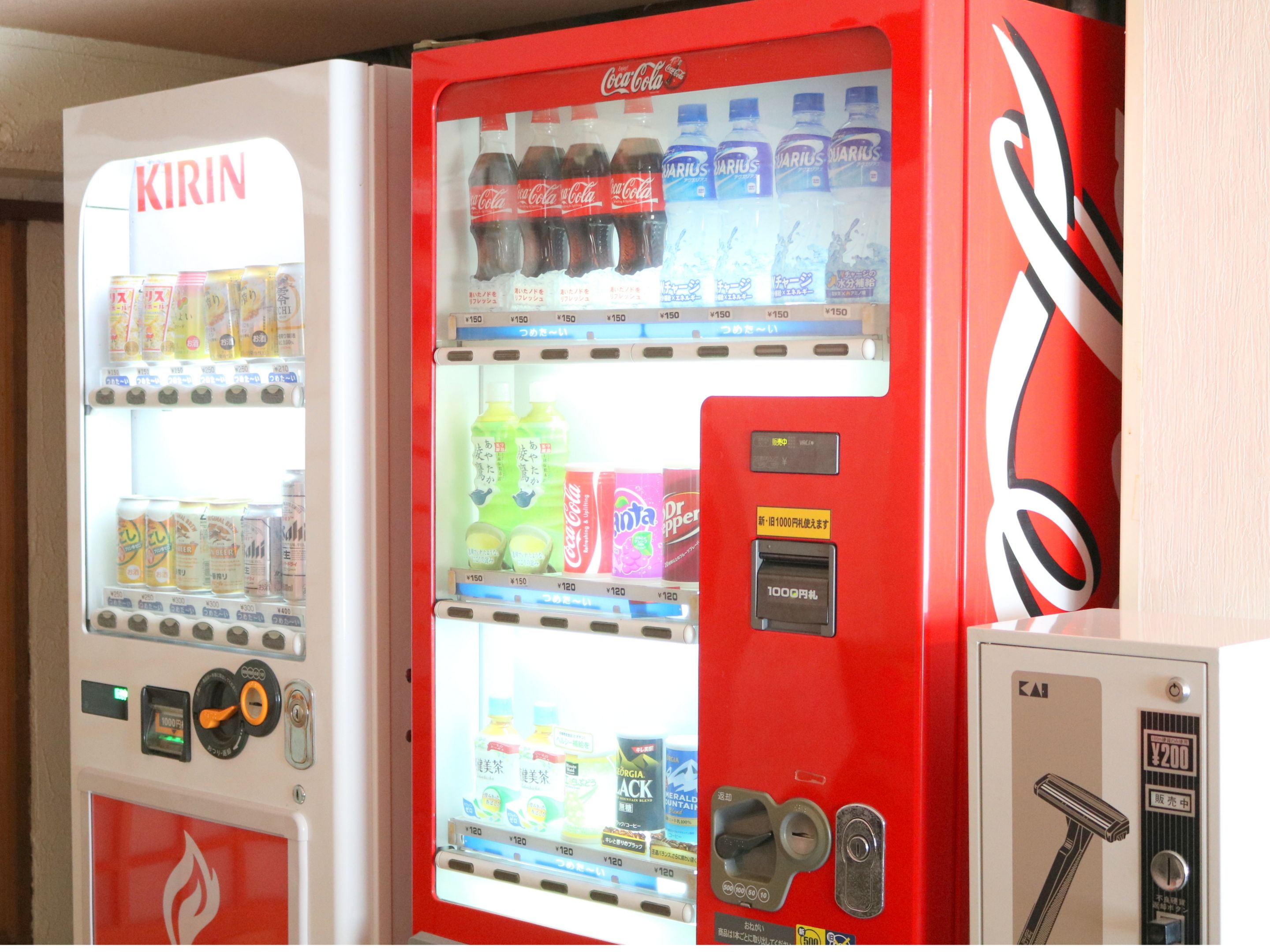 Two vending machines with various beverages and snacks.