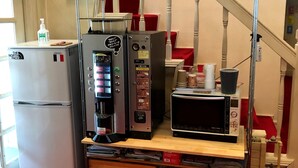 A kitchenette with a coffee machine, microwave, and a refrigerator. - Pension Ohayo (Hakuba)