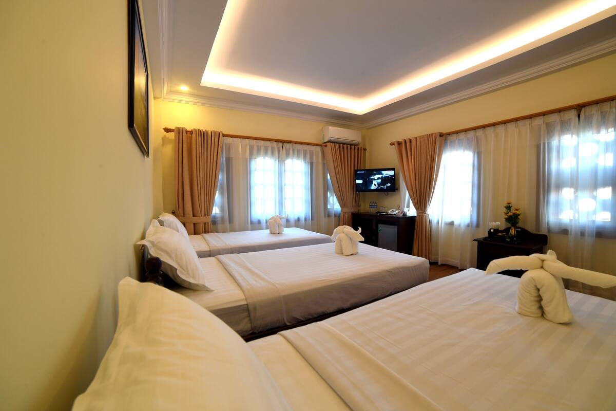 deluxe triple room | minibar, desk, blackout curtains, free wifi