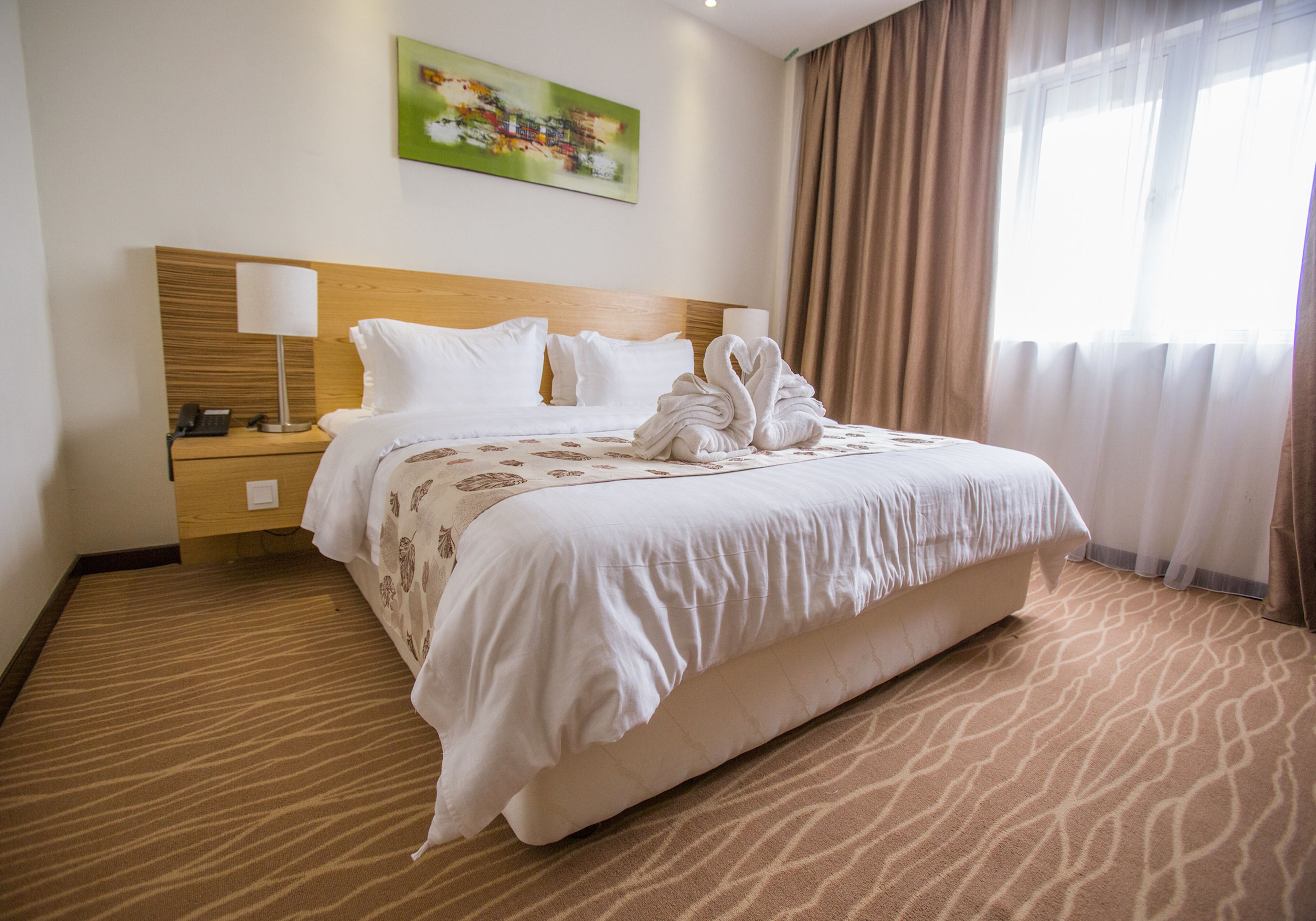 deluxe king room | in-room safe, desk, blackout curtains, soundproofing