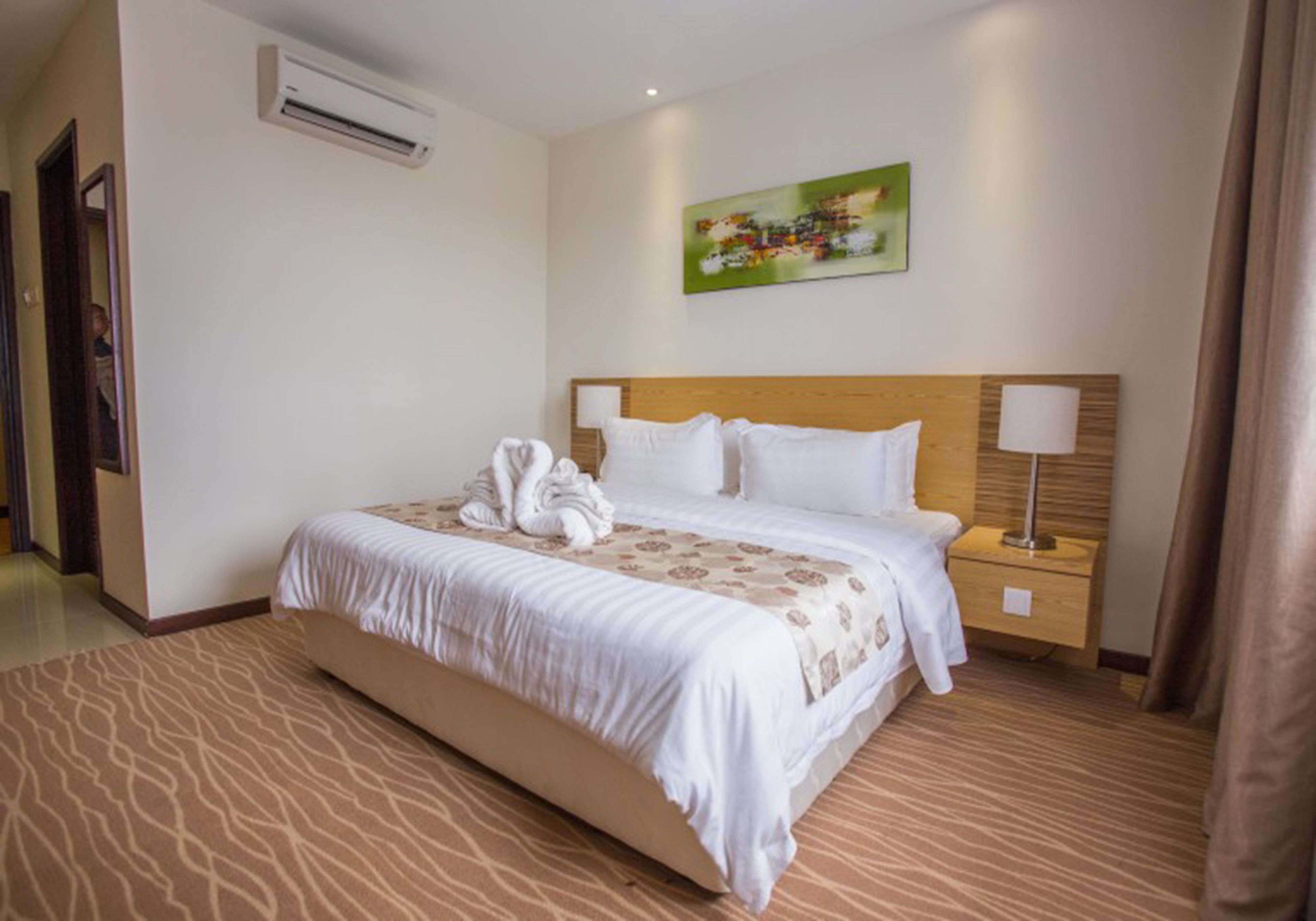 deluxe king room | in-room safe, desk, blackout curtains, soundproofing