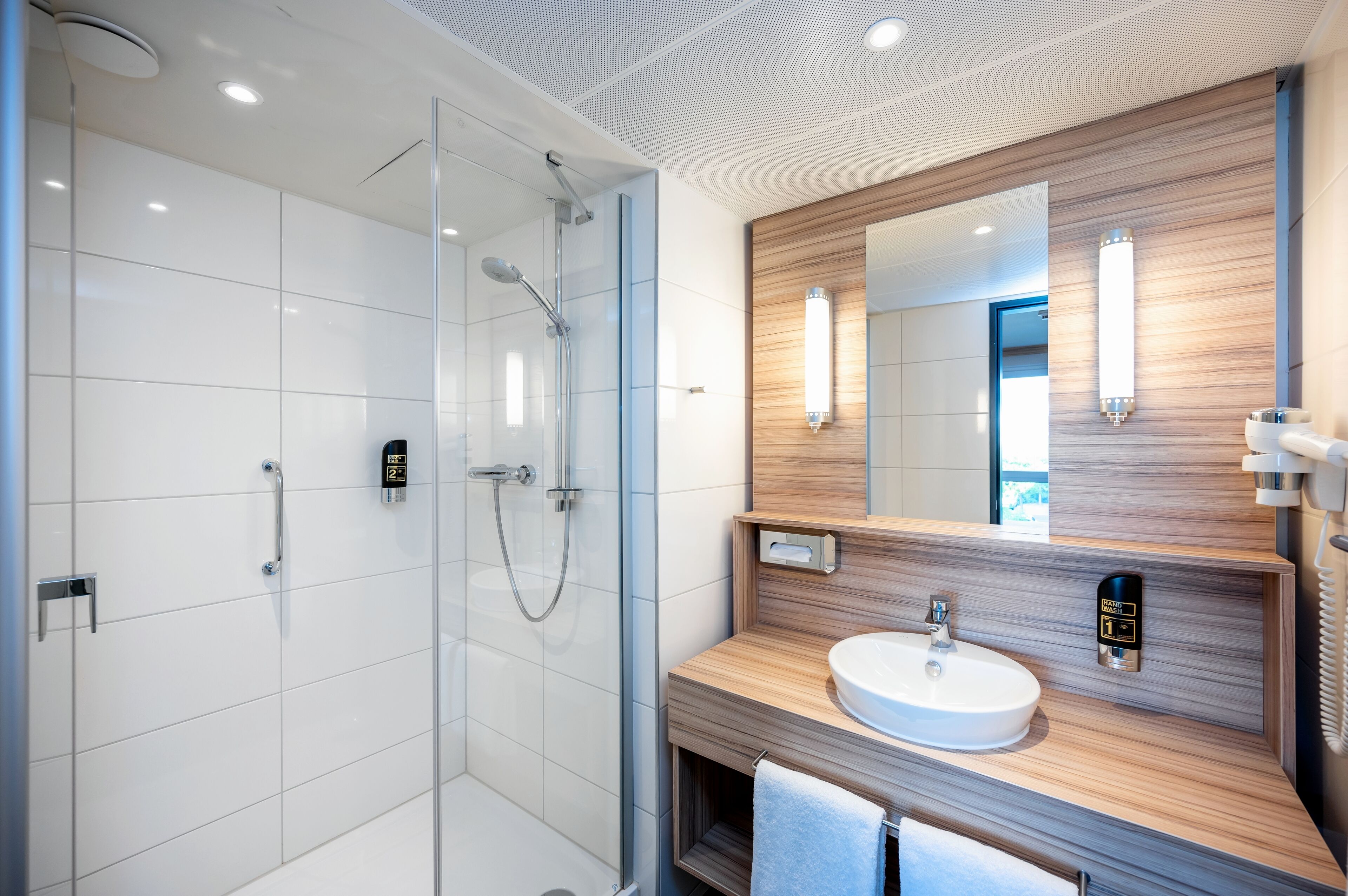 shower, free toiletries, hair dryer, towels