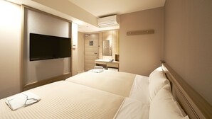 A hotel room with a large bed, a flat-screen TV mounted on the wall, a desk with a chair, and a bathroom with a mirror and sink. - Sotetsu Fresa Inn Tokyo-Kanda (Tokyo)