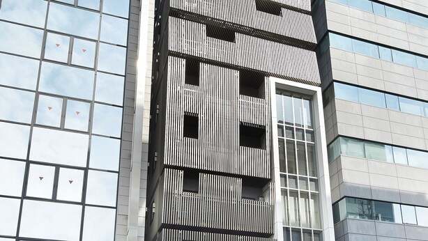 A modern hotel with a prominent sign, large windows, and a clean facade. - Sotetsu Fresa Inn Tokyo-Kanda (Tokyo)