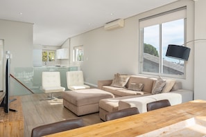 Comfort Apartment, 2 Bedrooms, City View | Living area | Flat-screen TV