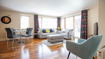 Deluxe Apartment, 2 Bedrooms | Living area | 42-inch LCD TV with cable channels, TV