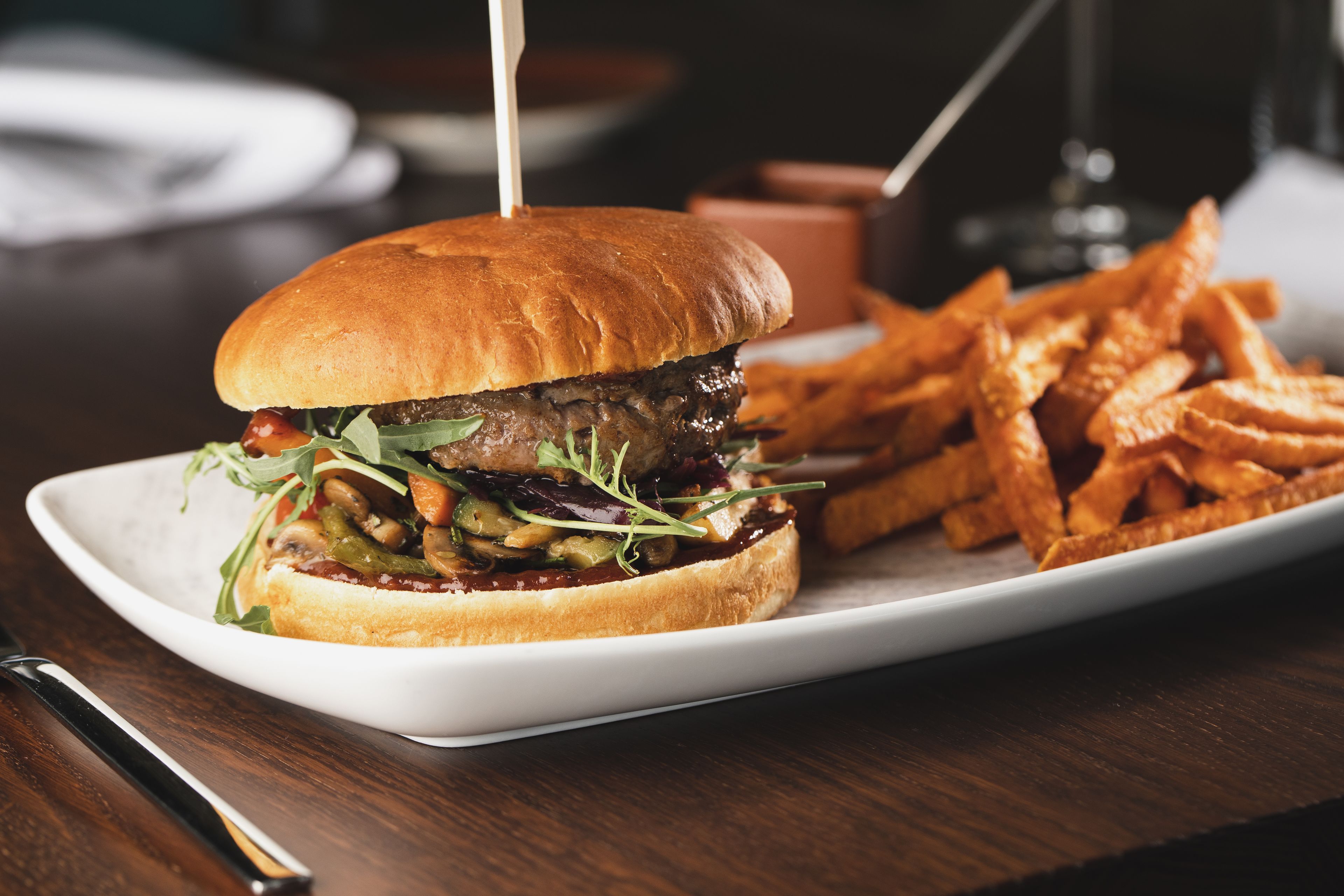 A plate with a burger and fries.