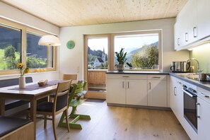 Apartment, 2 Bedrooms | Private kitchen | Fridge, stovetop, dishwasher, coffee/tea maker