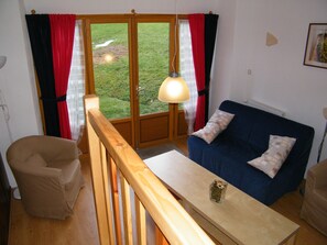 Family Apartment, 2 Bedrooms | Living area | 24-inch flat-screen TV with satellite channels, TV - Maison Neuve Grandval - Gite (Grandval)