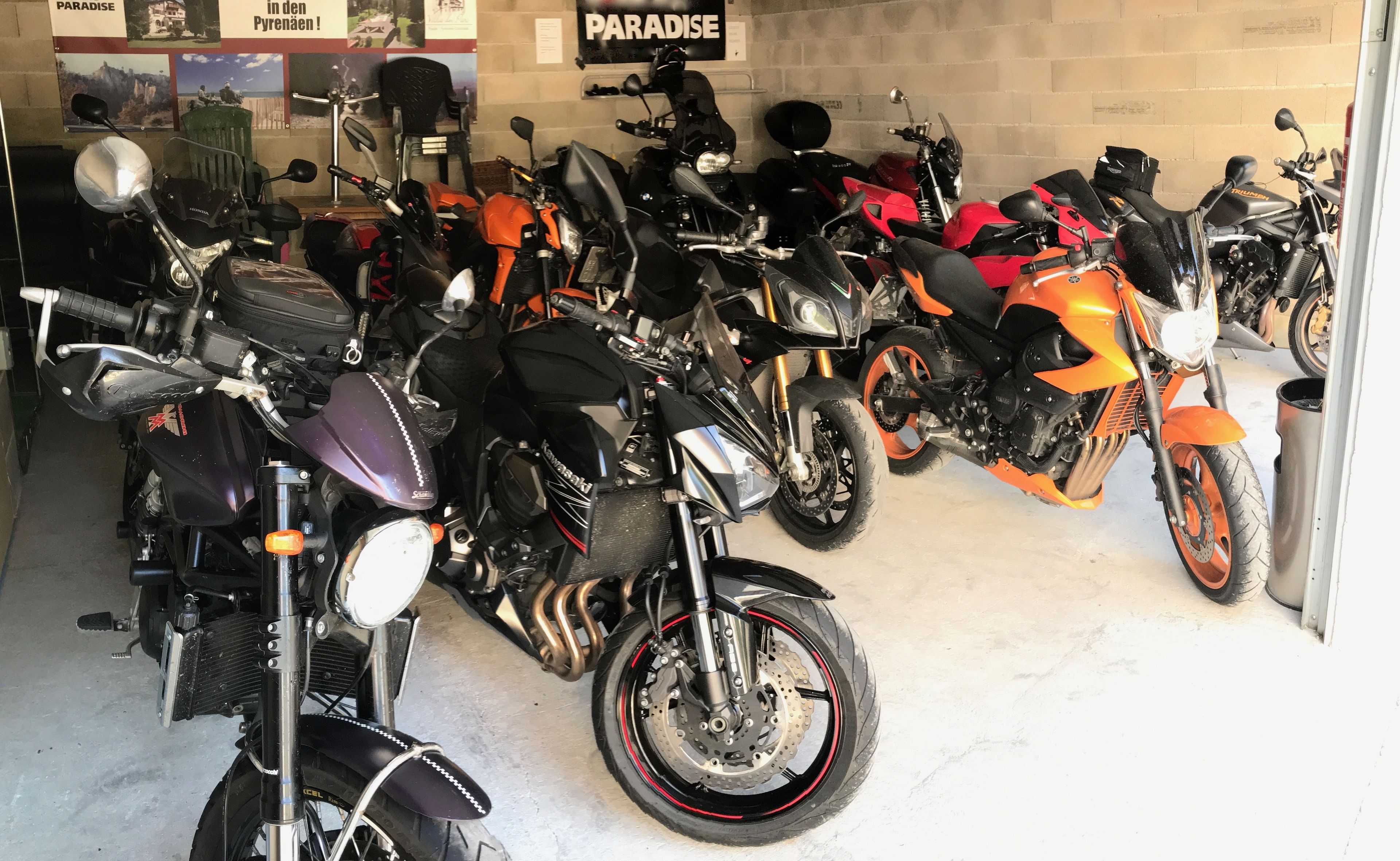 A motorcycle showroom with various models displayed.