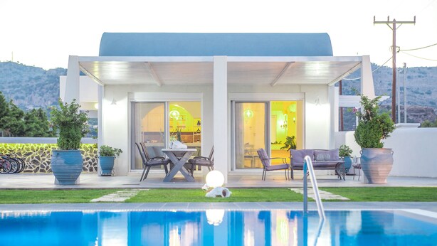 A modern house with a pool, outdoor furniture, and a mountain view. - White Passion Villa (Rhodes)