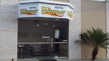 Hotel Winner's elegant entrance welcomes guests with a clear view into the interior.