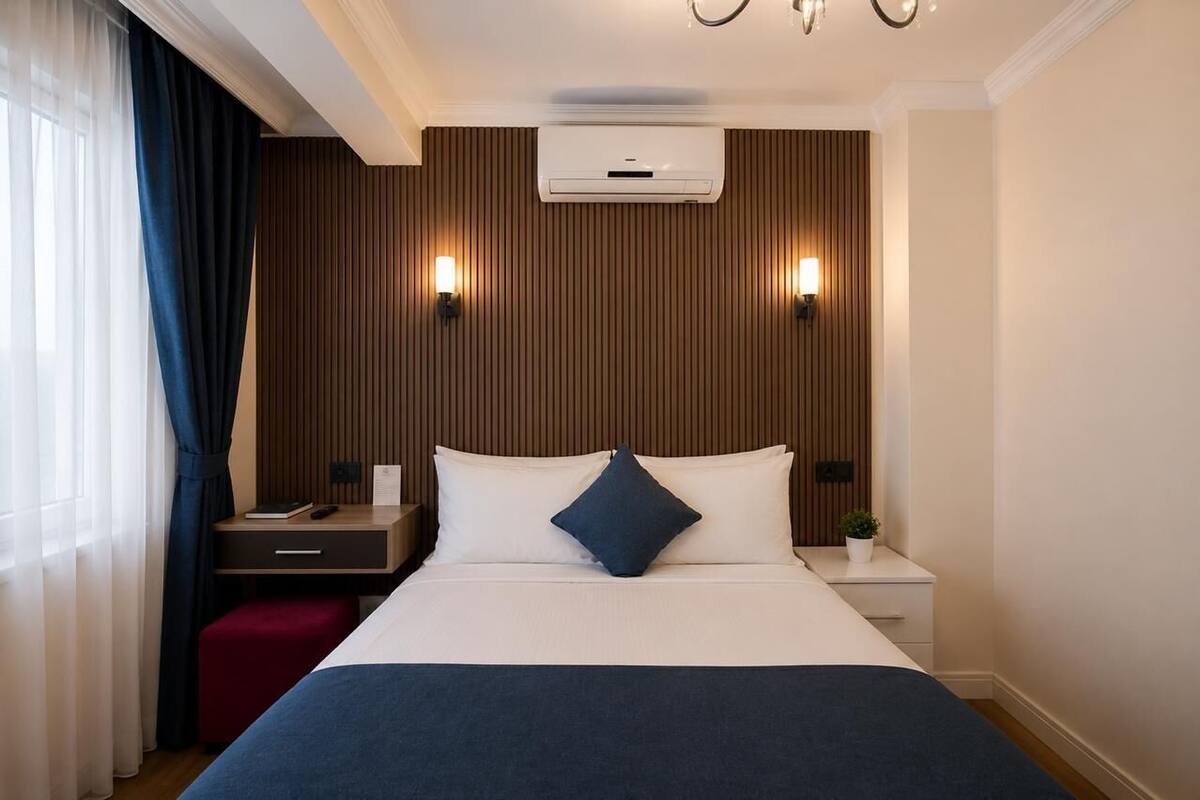 Chambre économique (Basement) | Draps en coton égyptien, literie de qualité, minibar