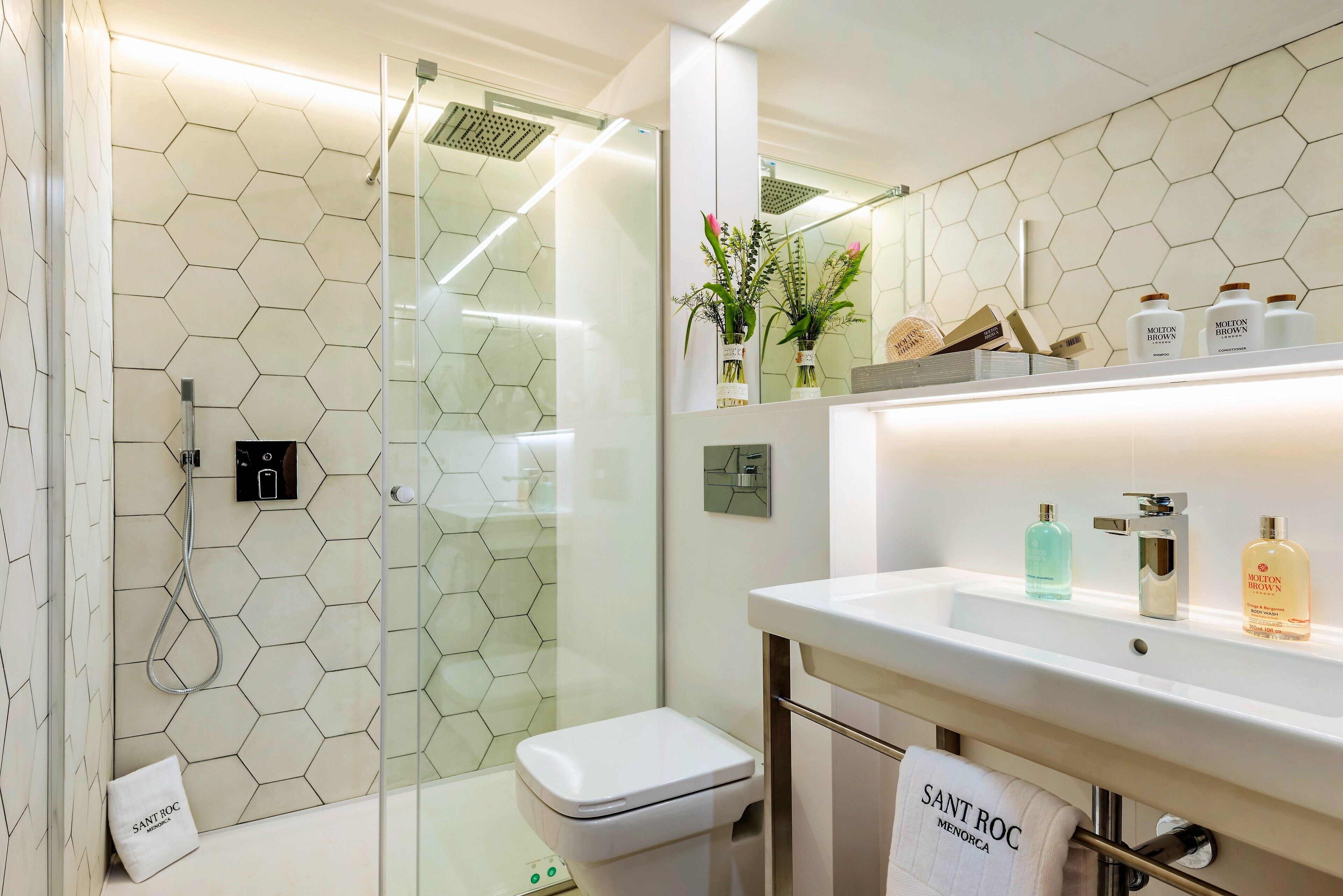 family suite | bathroom | shower, rainfall showerhead, designer toiletries, hair dryer