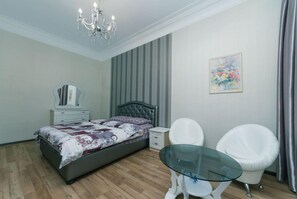 Apartment, 1 Bedroom | Desk, iron/ironing board, free WiFi, bed sheets