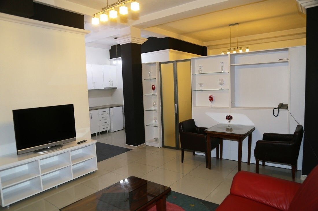 Deluxe Double Room | Living area | 40-inch flat-screen TV with cable channels, TV