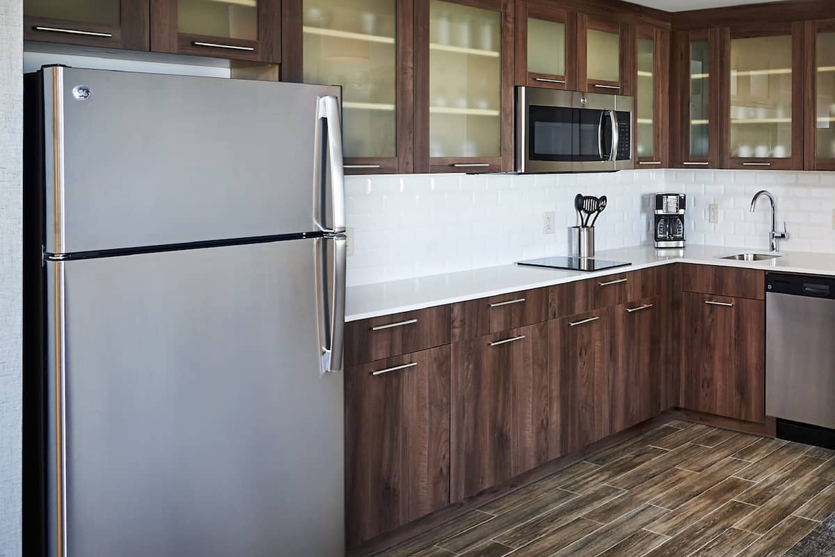 full-sized fridge, microwave, stovetop, dishwasher