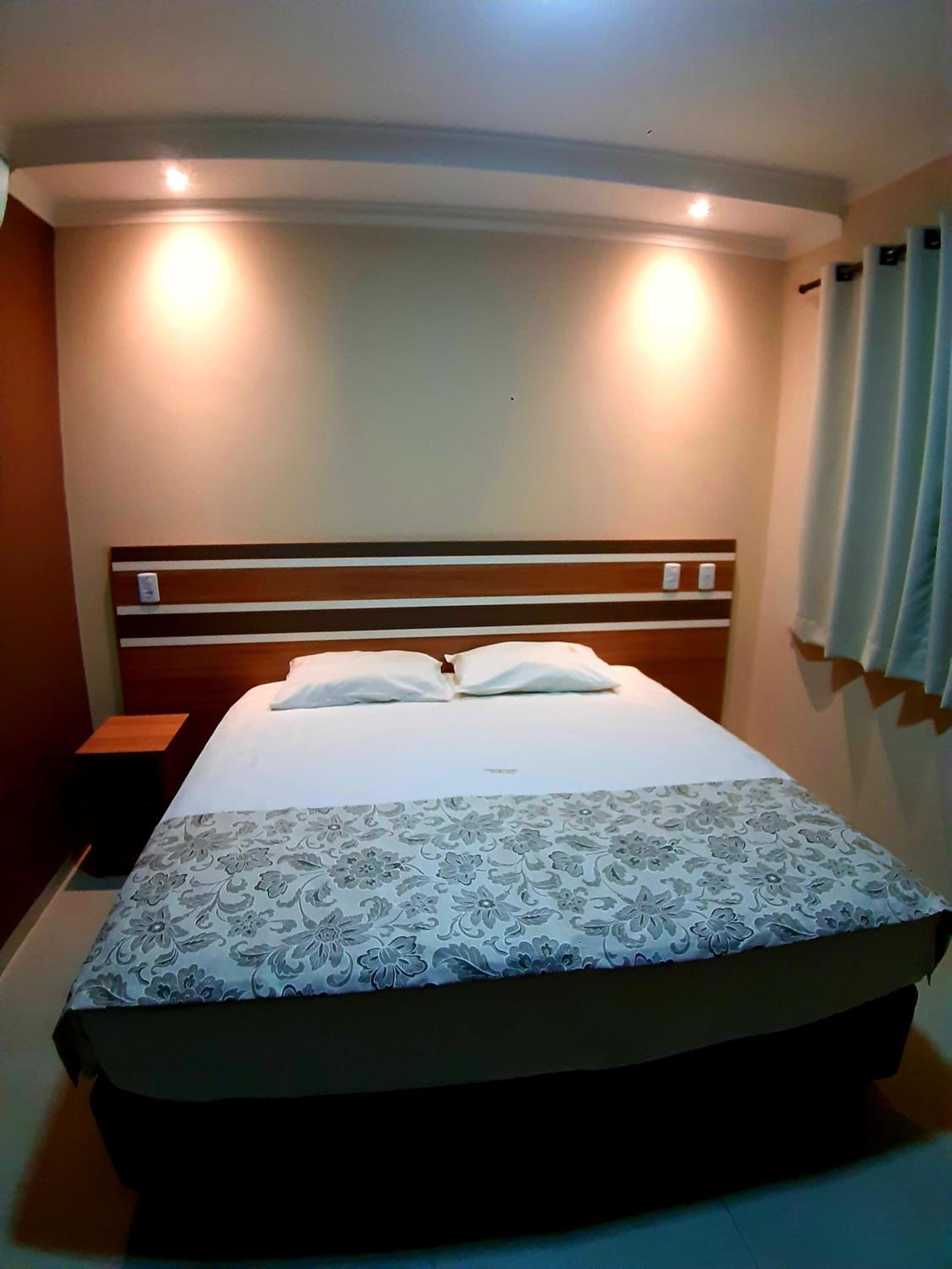 minibar, desk, blackout curtains, iron/ironing board