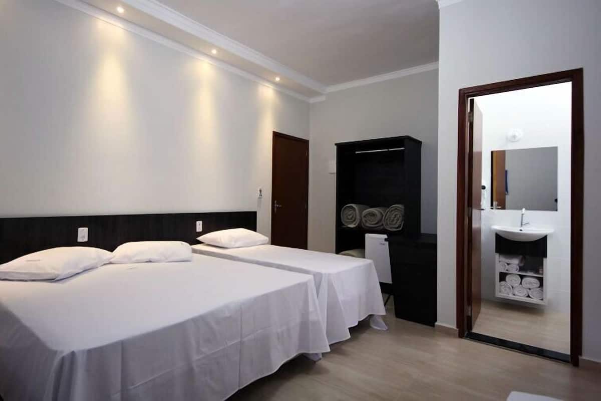 Triple Room | Minibar, desk, blackout curtains, iron/ironing board