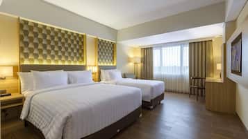 Luxe beddengoed, een minibar, een kluis op de kamer, een bureau