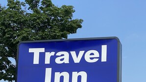 A blue sign with white text reading "Travel Inn". - Travel Inn (Broadview)