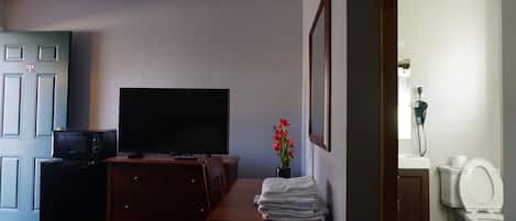 Chambre simple | Aire de séjour