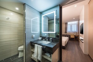 Designer toiletries, hair dryer, bathrobes, slippers