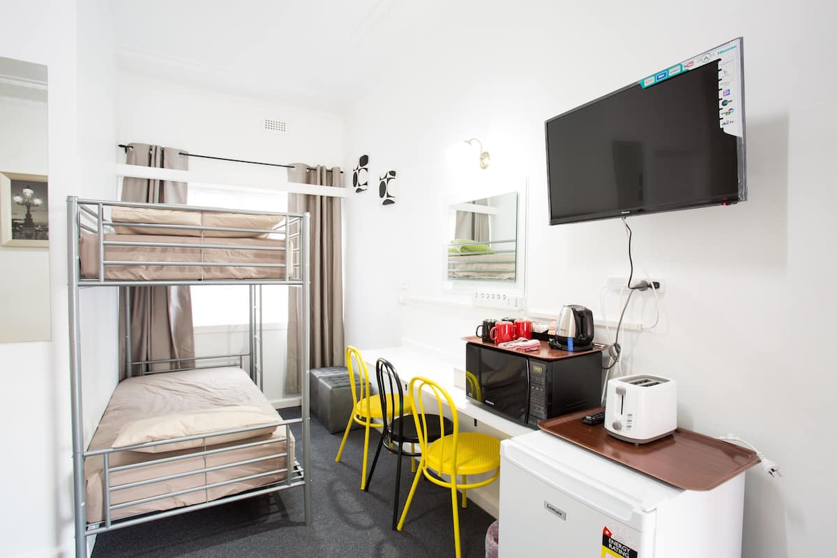 Premium bedding, pillow-top beds, desk, laptop workspace