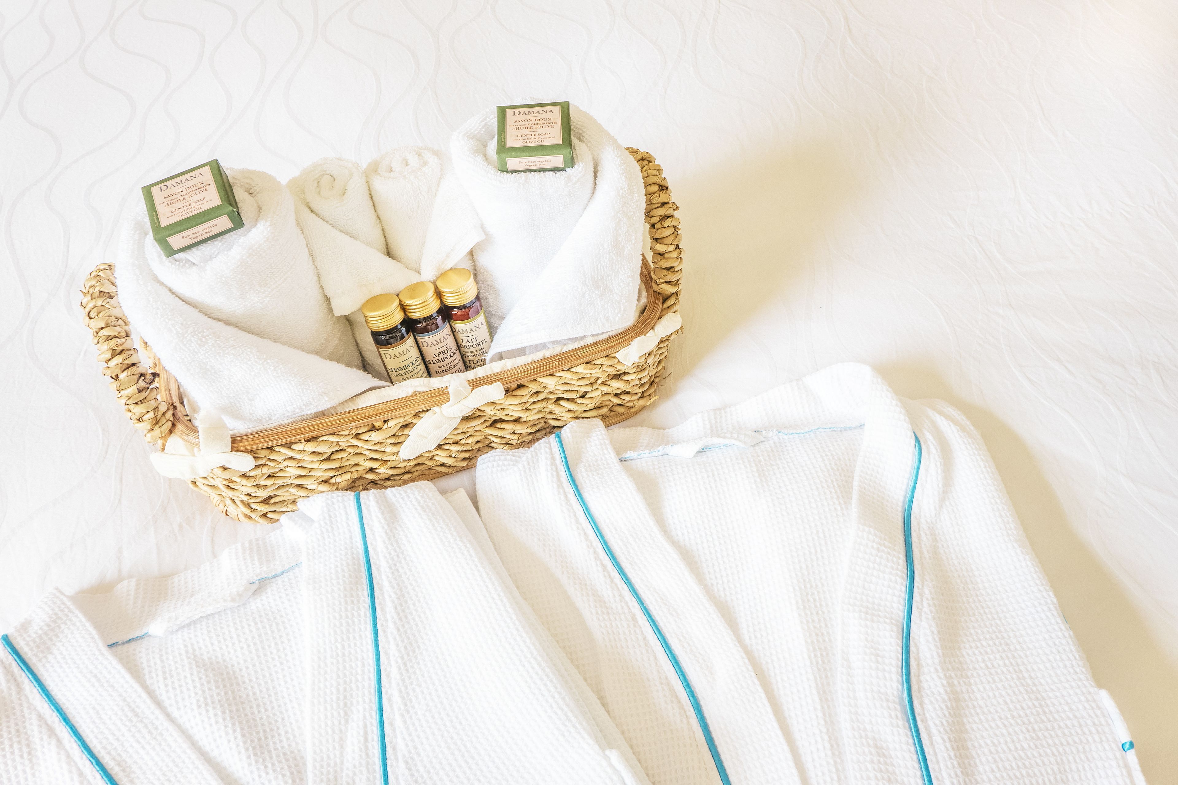 designer toiletries, hair dryer, bathrobes, slippers