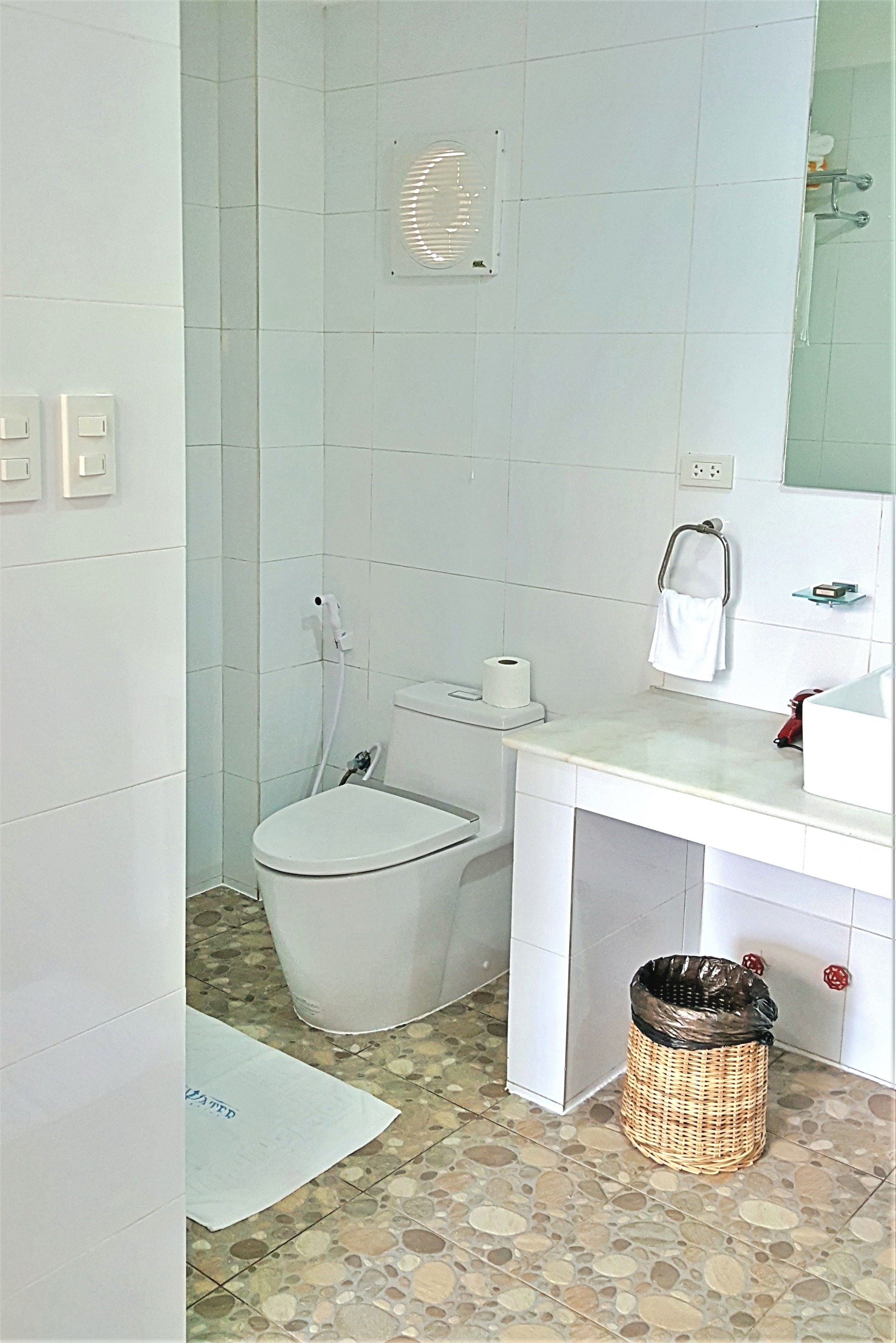 designer toiletries, hair dryer, bathrobes, slippers