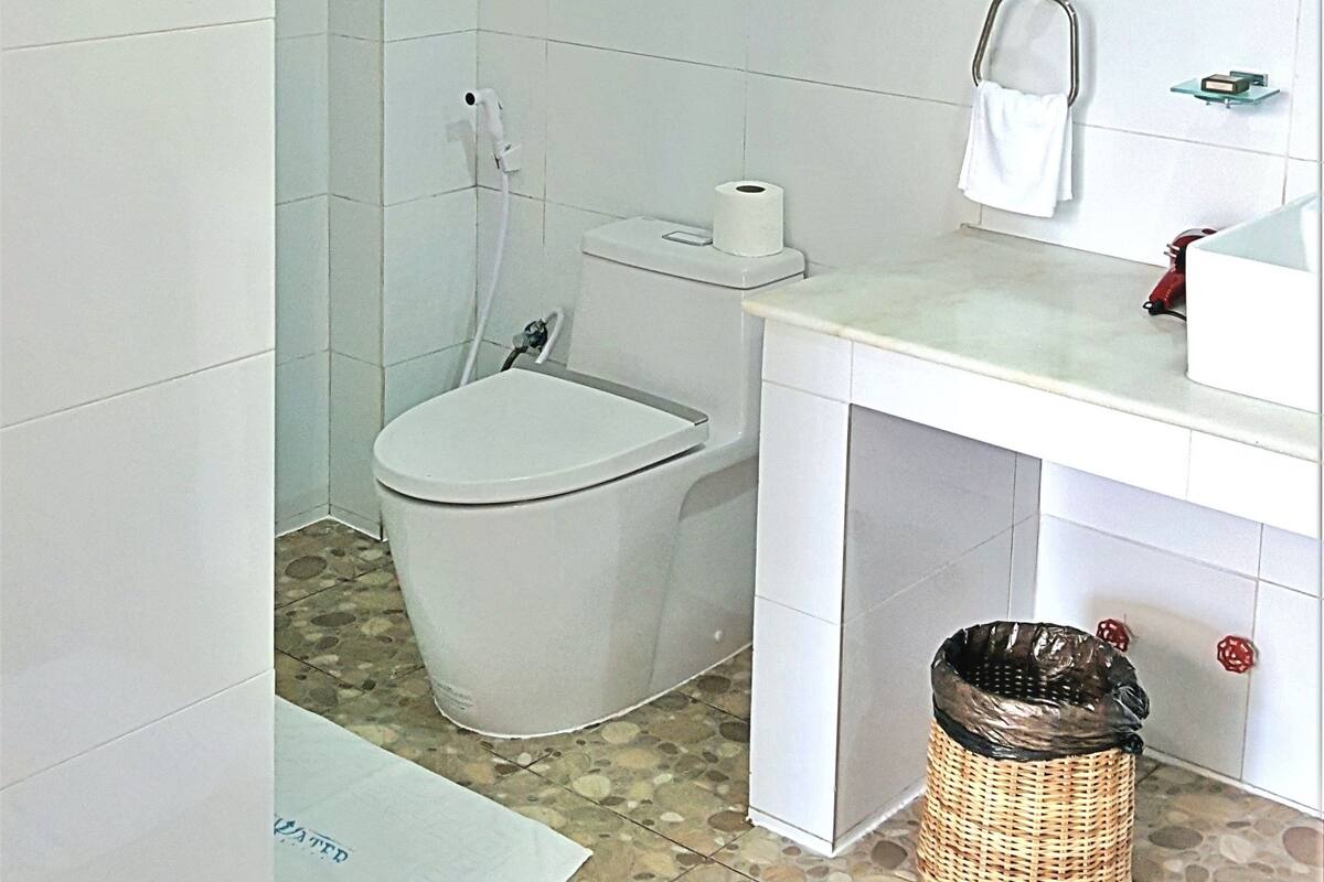 designer toiletries, hair dryer, bathrobes, slippers