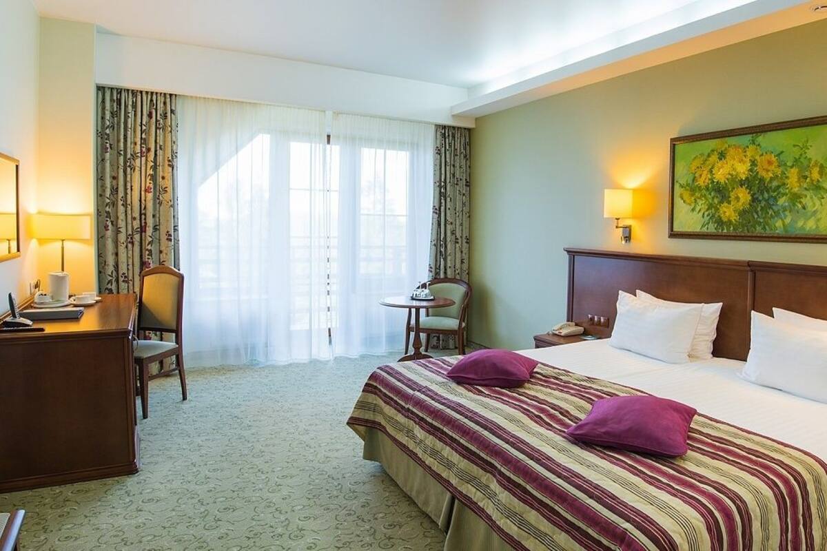 Superior kamer, 1 twee- of 2 eenpersoonsbedden | Luxe beddengoed, een minibar, een kluis op de kamer, een bureau