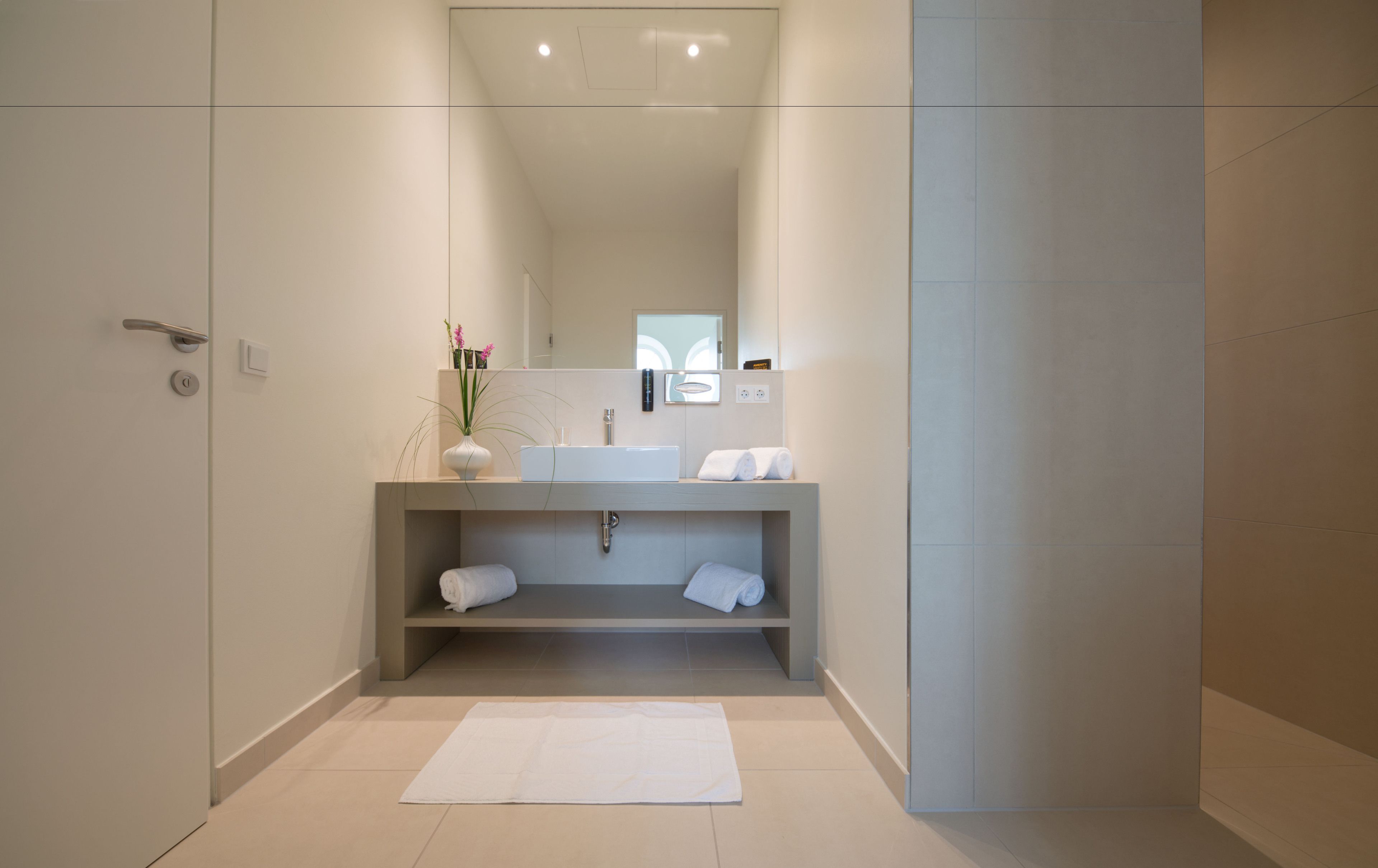 junior suite | bathroom | shower, free toiletries, hair dryer, bathrobes