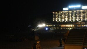 A multi-story hotel with illuminated windows and a sign reading "Hotel Marina Centro". - Busan Haeundae Travel Pension (Busan)